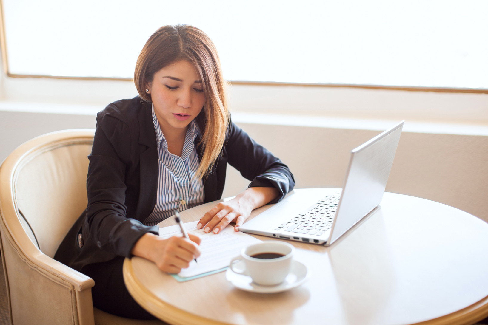 Female attorney reviewing some contracts